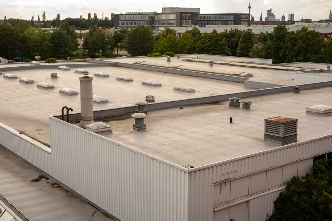Commercial TPO membrane installation on a Dallas office building